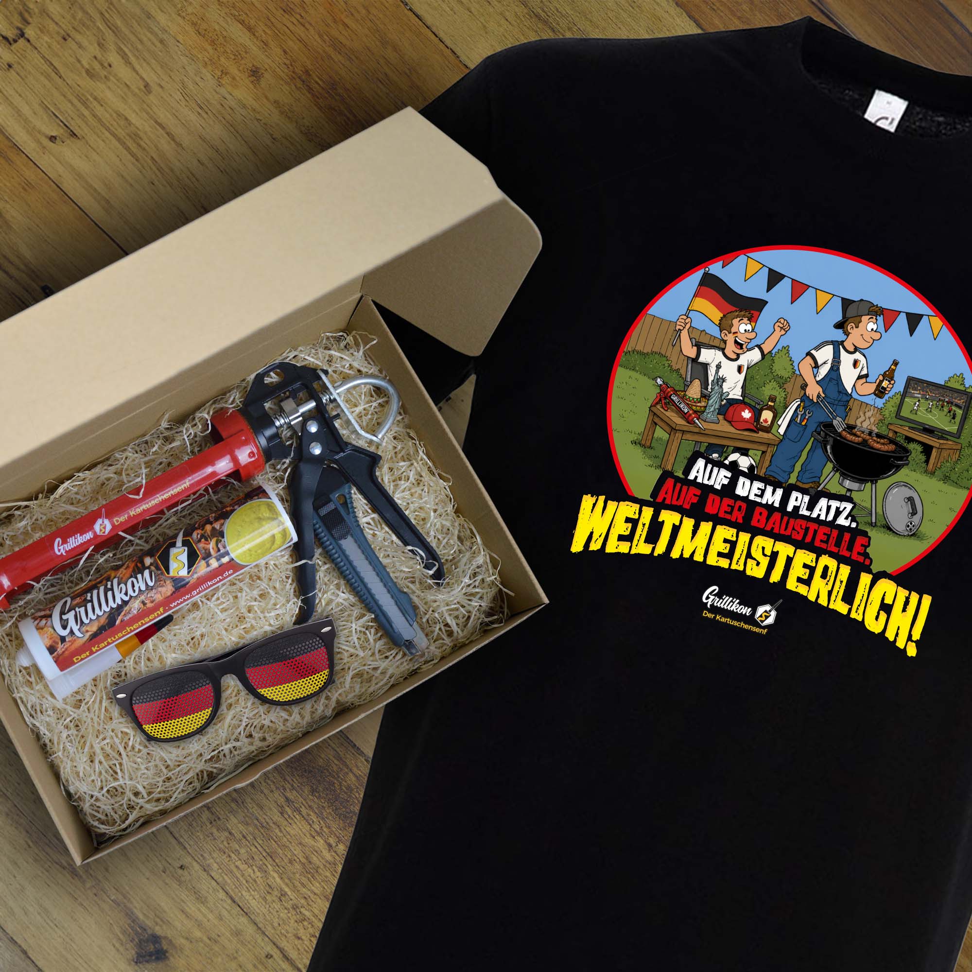 Grillikon Geschenkset „WM-Edition“ im Geschenkkarton mit 300 ml Senfkartusche, Kartuschenpistole, Cuttermesser, Fanbrille Deutschland und schwarzem WM-T-Shirt